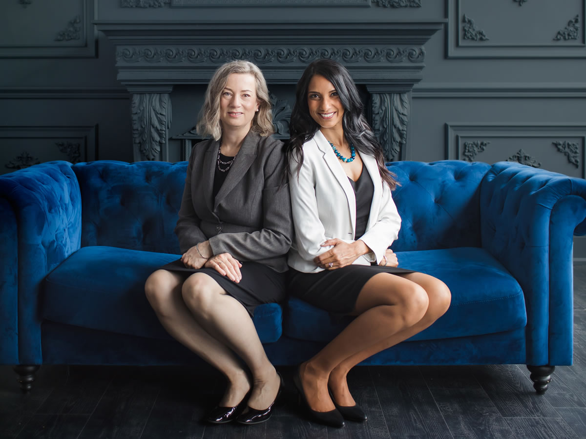 Jan Goddard and Nimali Gamage on Blue Couch